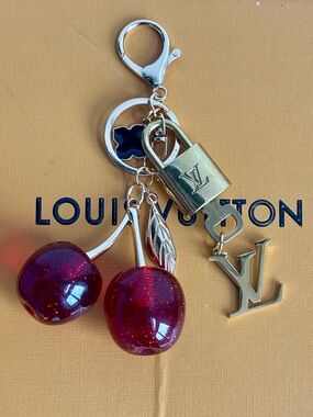 AUTHENTIC LOUIS VUITTON
BRASS LOCK AND KEY #315, LG. RED CHERRY BAG CHARM, 5 in
